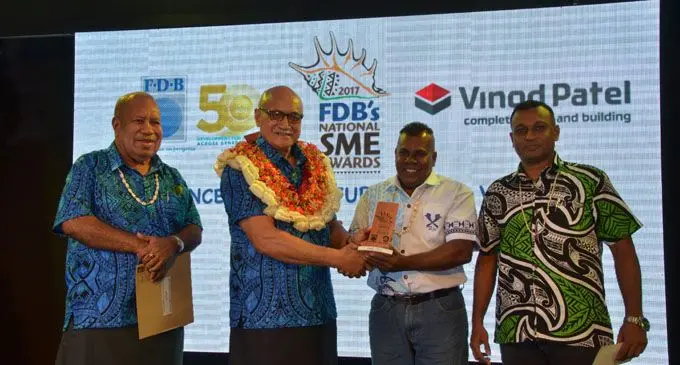 President, Major-General (Ret’d) Jioji Konrote handing over Hari Deo’s award at the 2017 FDB National SME Awards night .   Photo: Fiji Development Bank.