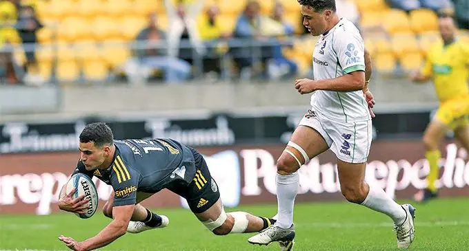 Swire Shipping Fijian Drua first five eight Caleb Muntz (right) chases Joshua Moorby who scores the first of his two first-half tries during their Super Rugby Pacific clash at thge Sky Stadium in Wellington on May 8, 2022. Photo: Stuff