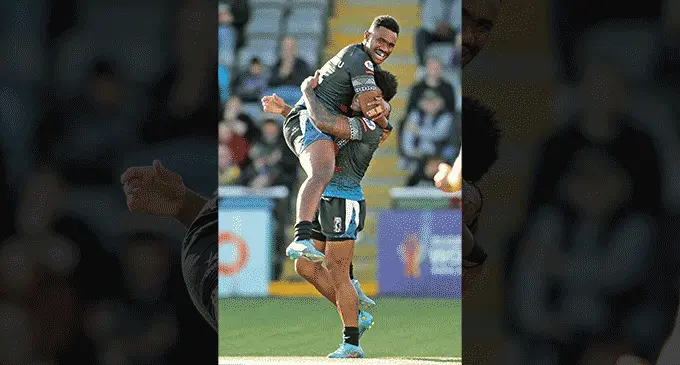 Vodafone Fijian Bati winger Vuate Karawalevu celebrates with captain Kevin Naiqama after he scored a try in their 60-4 win over Italy on October 22, 2022. Photo: FNRL.
