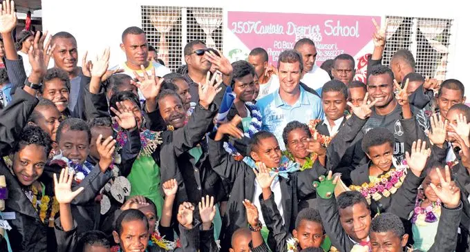 Fiji Seven side with Coach, Gareth Baber with Cautata District School prefects during their induction ceremony on February 16, 2018. Photo: Ronald Kumar.