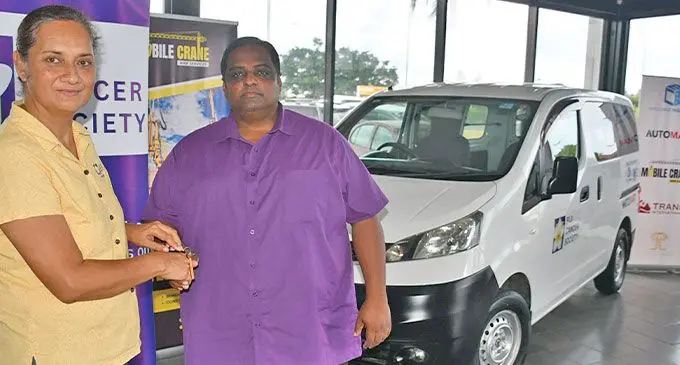 Fiji Cancer Society chief executive officer Belinda Chan, left, receives the key from Challenge Group chief executive officer Salesh Kumar. Photo: Waisea Nasokia
