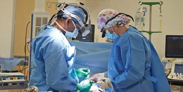 An open-heart surgical team performs life saving surgery on a child at the Sri Sathya Sai Sanjeevani Children’s Hospital in Suva.