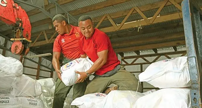 Republic of Fiji Military Forces (RFMF) personnel offloading food rations in the storage facility in Vatunibale, Labasa on January 4, 2020.   Photo: National Disaster Management Office