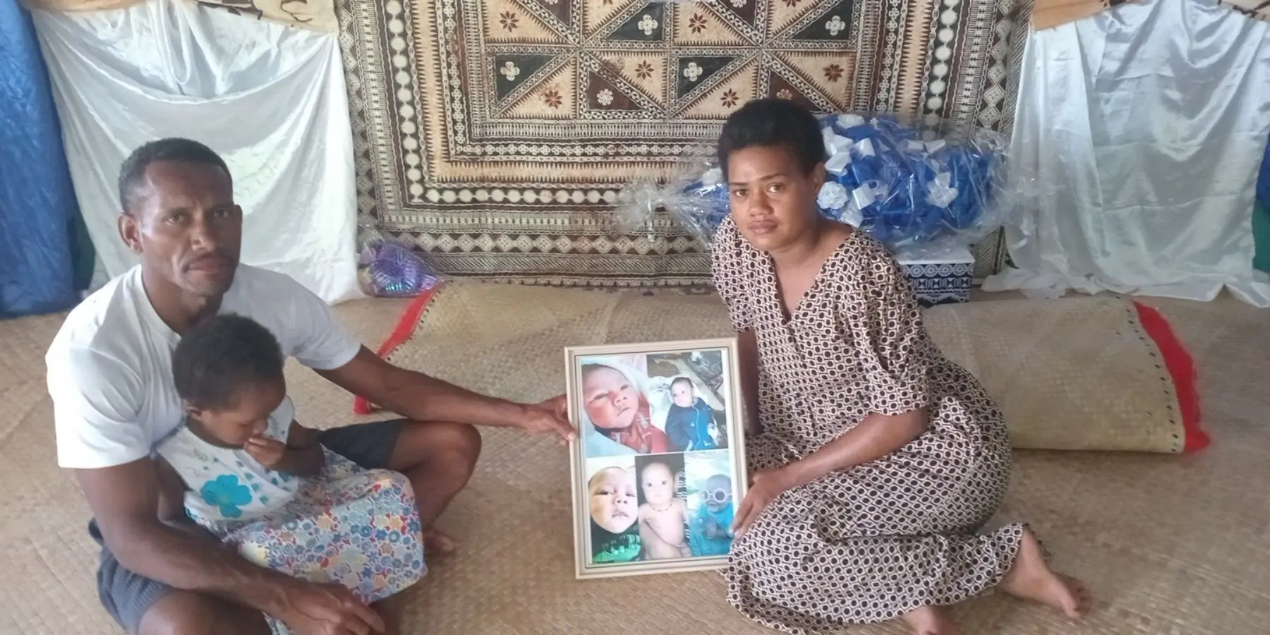 : Etuate Lalabalavu and Mereseini Diuca with their daughter at their home in Tiliva Village, Kadavu, after the death of their six-month-old son Joeli Lalabalavu on Boxing Day.