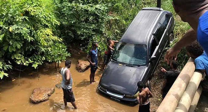 The submerged vehicle being pulled out of the river near Wailekutu Settlement. Photo: Josefa Babitu
