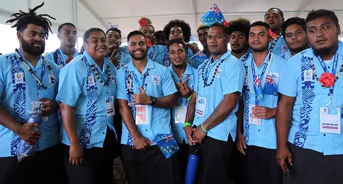 Elenoa Kunatuva (second from left) with the Tuvalu 7s team during the opening ceremony of the Pacific Games in Apia, Samoa on July 7, 2019. Photo: Anasilini Natoga