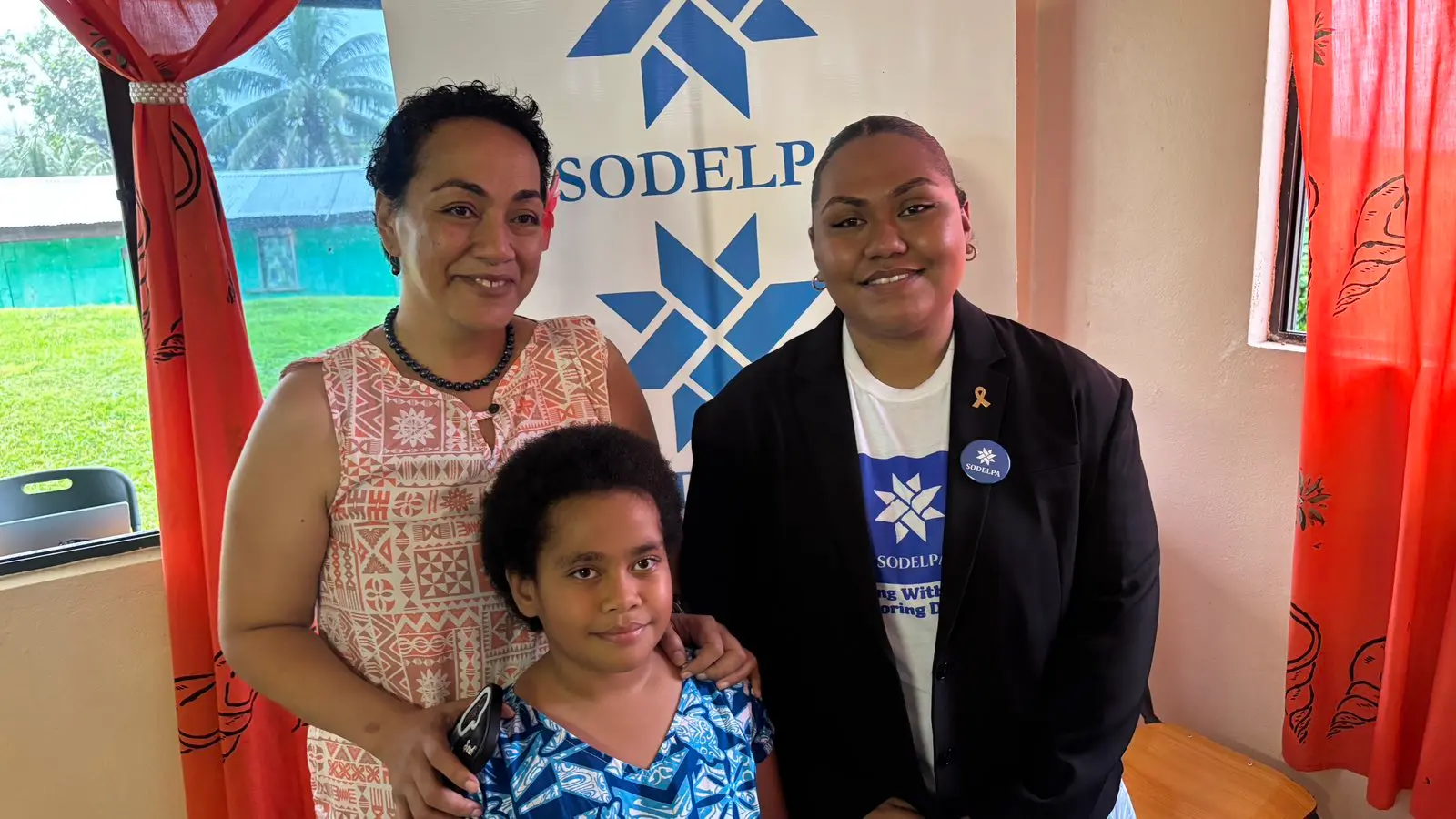 From right: AnneMarry Raduva, her mother Moira Vilsoni, and her youngest sister Eunice Raduva during the SODELPA Annual General Conference at Suvavou Village Hall on Saturday.