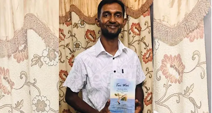 Aswak Mustapha with his book – ‘Tui Wai, The Story of the Warrior Mangrove Tree’.