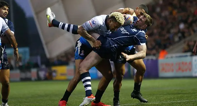 Viliame Kikau gets tough on a Scottish player during their final group match at the Rugby League World Cup in England on October 29, 2022. Photo: AFP 
