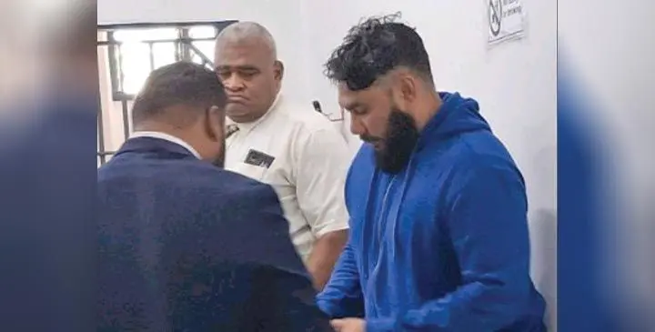 Drug accued Justin Ho (wearing a blue sweater), with his lawyer at the Nadi Magistrate Court on May 28, 2025. Photo: Mereleki Nai
