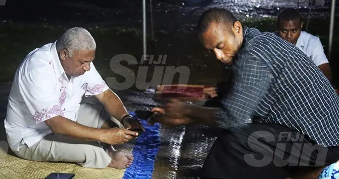 Prime Minister Voreqe Bainimarama presents his reguregu at the residence of the late Police Constable (PC) Siuta Niumataiwalu at Muanikoso on October 23, 2019. Photo: Ashna Kumar