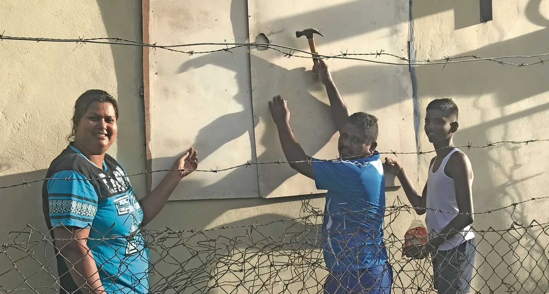 Shabana Nisha,and Rakesh Kumar and Shanil Shafiz board up their home in Lovu Lautoka.   Photo: Lusi Banuve