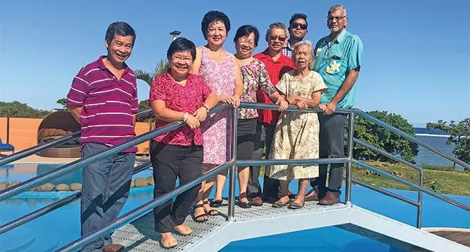 From left: Henry Seeto, Beverley Seeto, Jenny Seeto, Lorraine Seeto, the late Dixon Seeto, Azum Khan, Seeto Hui, and with close family friend and Hexagon Group chairman and business partner Hafiz Khan. Photo: Charles Chambers