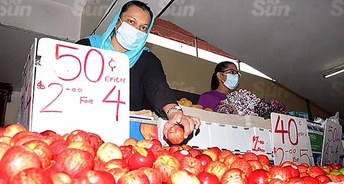 Suva market vendor Moreen Ali with her daughter Suhana Khan as they sell their produce at market. Photo: Ronald Kumar
