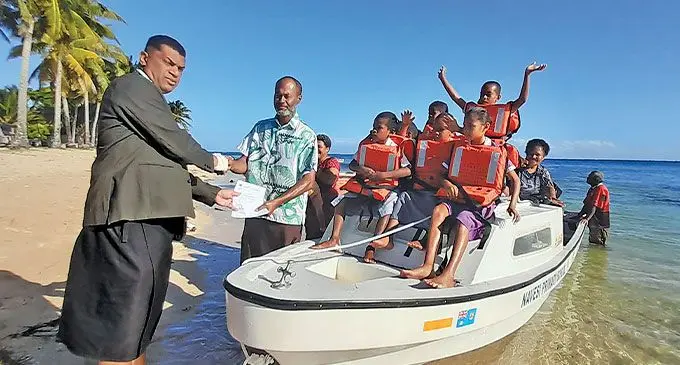 Minister for Education Aseri Radrodro officially hands over the boat and engine to Navesi Primary School on Totoya Island in Lau. Photo: Wati Talebula-Nuku