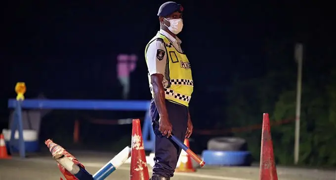 Police on guard at a checkpoint. Photo: Fiji Police Media Cell