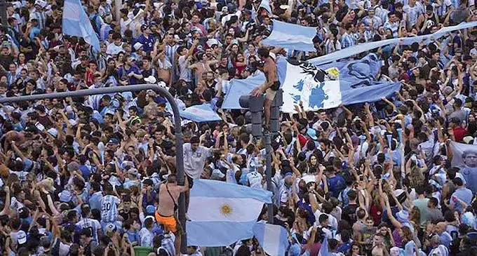 Argentine soccer fans celebrate their team’s World Cup victory over France in Buenos Aires on December 19, 2022. Photos: AP