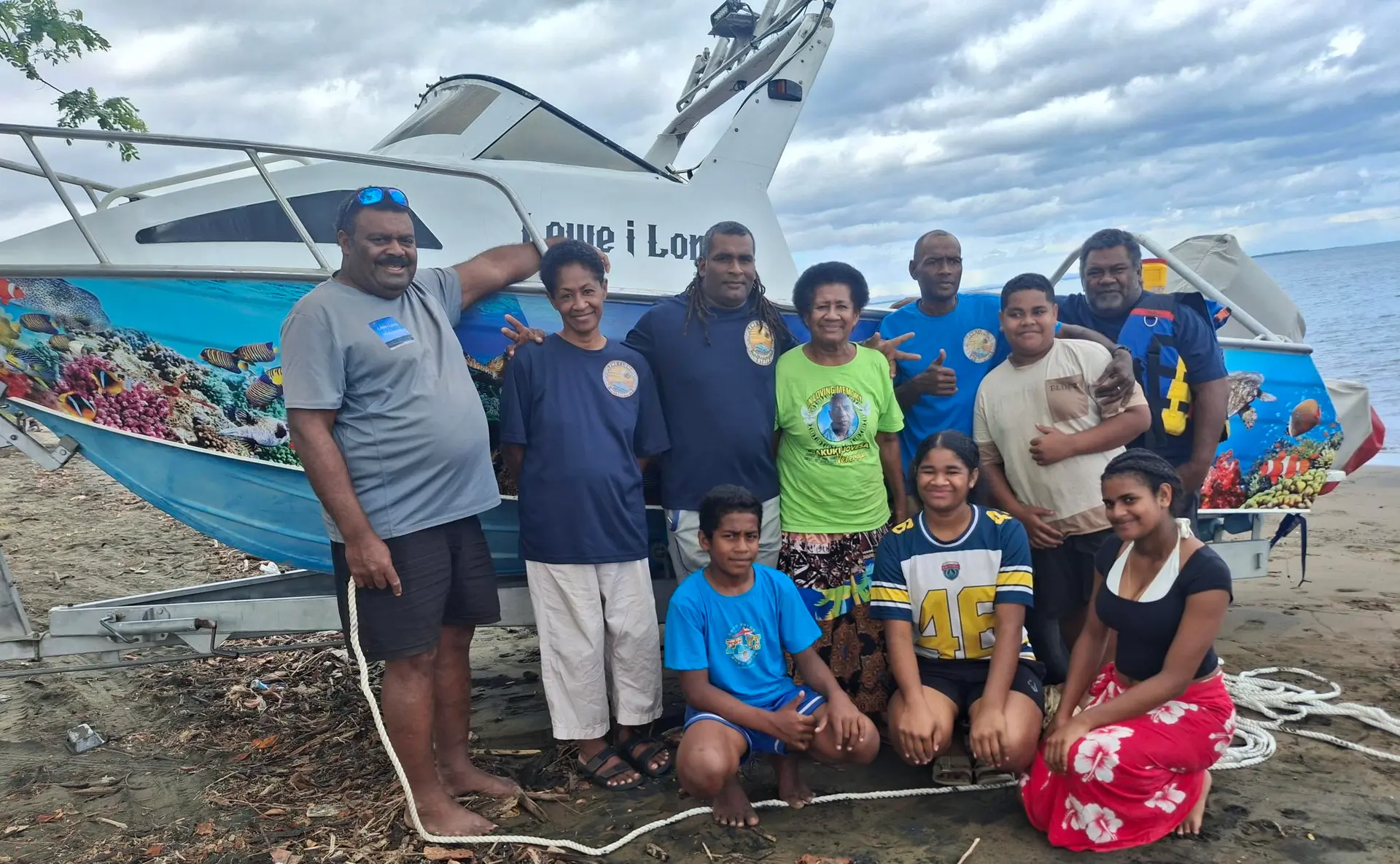 Osea Naisilasila (standing left) with his family from Lomolomo Village during the Fiji Day public holiday. 