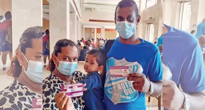 Couple Ravin and Shayal Prasad with their son, Manvik Prasad after receiving their booster shot at Civic Centre vaccination centre on Januaray 11, 2022. (Vaccination centre opens from 9am-3pm) Photo: Ronald Kumar