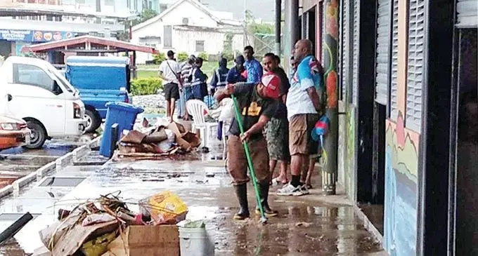 Members of the public clean up the area infront of the Rakiraki market.
