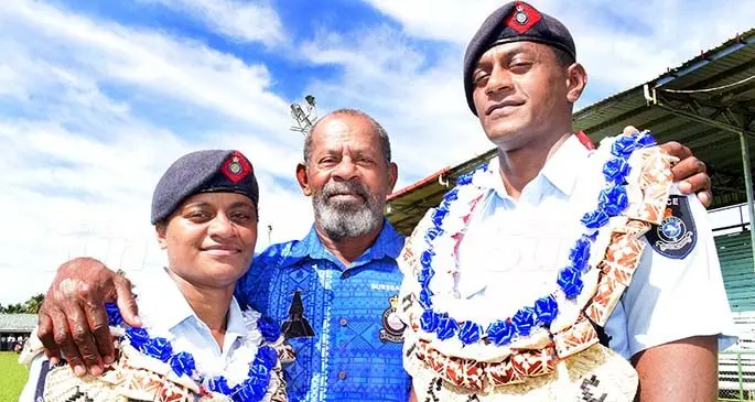 Retired Police Inspector Taito Waqavakatoga (middle) with daughter Diana Waqavakatoga and son Waisale Waqavakatoga following the Basic Police Recruitment passing-out parade at Ratu Cakobau Park in Nausori on July 16, 2020. Constables Diana and Waisale come from a long line of Police officers in the family. Photo: Ronald Kumar 