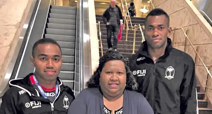 Waisea Nacuqu(left) and Sevuloni Mocenacagi(far right) with a fan as they depart Las Vegas on March 5,2018.  Photo: Eroni Sau 
