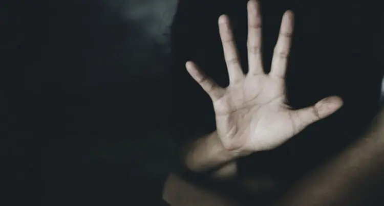 A hand reaching out, with palm facing forwards.