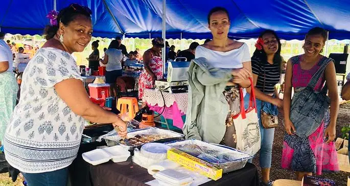 Left: Leanne Heritage serves customers at the Suva Bowling Club’s weekly Sunday market. Photo: Frederica Elbourne