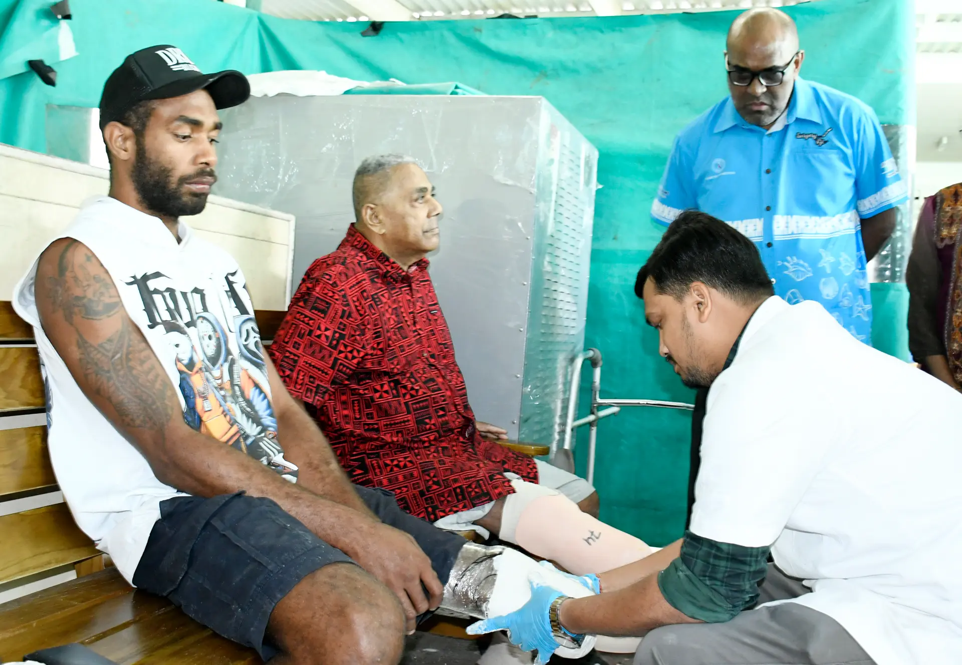 Amputees Ratu Peni Drodolago, 25 and Maika Ravouvou  74 gets assist by Jaipur foot camp assistant Dibuya Jnanabeura as Minister of Health looks on at Twomy hospital, Tamavua on October 12, 2026.