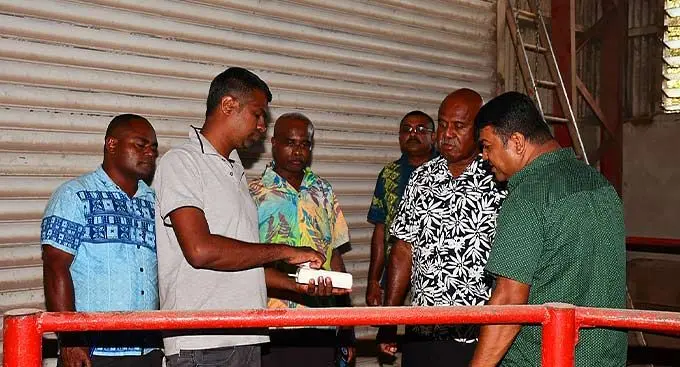 Assistant Minister in the Office of the Prime Minister, Sakiusa Tubuna, being briefed on the operations of the Fiji Rice Limited Dreketi Mill on January 7, 2023.