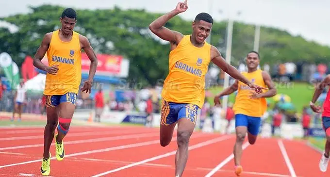 Semesa Caginivalu (second from left) of Suva Grammar celebrate his senior boys 100meters final win during Suva Zone 2 at HFC Stadium on April 4, 2024. Photo:Ronald Kumar.