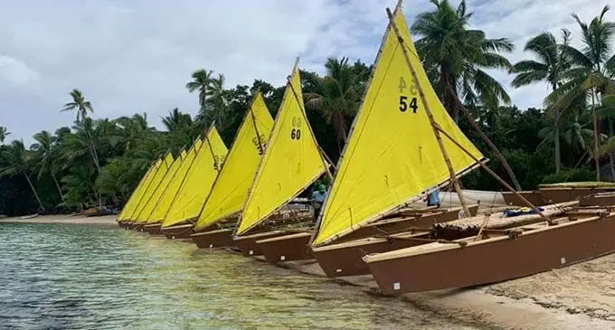 Camakau canoes assembled at Leluvia Island before its journey to Nasesara Village.  Photos: Leleuvia Island Resort