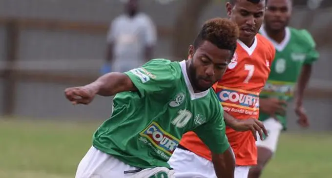 Nadogo's Inia Catarogo (left) looks for support against Bua's Vikash Prasad during Courts IDC at ANZ Stadium. Photo:Ronald Kumar.