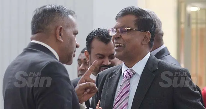 FijiFirst Government MP Faiyaz Siddiq Koya (left), with NFP leader and Opposition member Biman Prasad, outside Parliament on March 27, 2020. Photo: Ronald Kumar