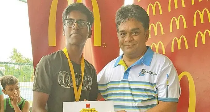 Dhiraj Nadan receiving from McDonald’s Fiji Group Financial Controller Lalin Gonesekera. Photo: WAISEA NASOKIA