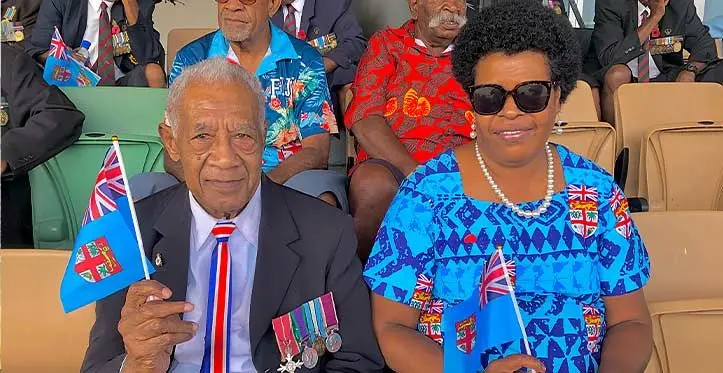 From left: Romanu Naceva, 84,and wife Kesaia Lolou with their Fiji flags, ready for the celebrations to begin. Photo: Beranadeta Nagatalevu