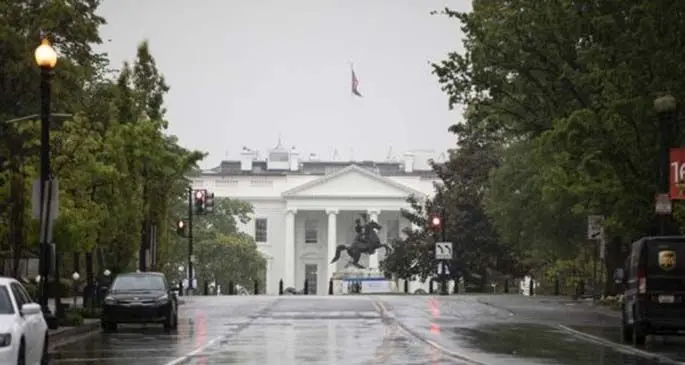 An empty street near the White House is seen during rush hours in Washington D.C. April 23, 2020. (Photo by Ting Shen/Xinhua)