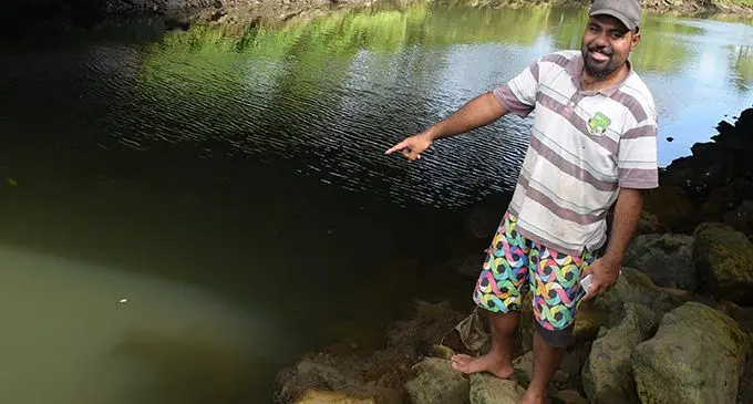 Simon Tuinidau points at the river where people dump rubbish at the Bailey bridge, Laucala Beach Estate,  Nasinu, on February 24, 2019. Photo: Simione Haravanua