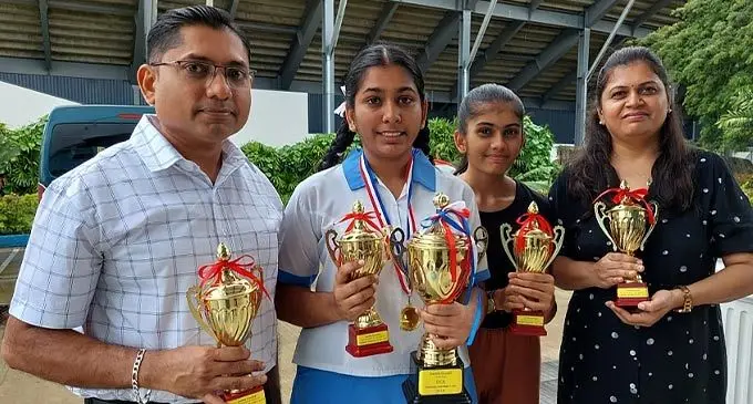 From left: Sandip Chauhan (dad), Xavier College Dux, Tanisha Chauhan, her sister Prathna and her mum, Mayuri at the College in Ba on November 11, 2022. Photo: Nicolette Chambers