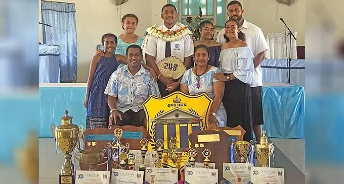 Queen Victoria School 2022 dux, Seruitubuna Vosarogo and his family. Photo: Wati Talebula-Nuku