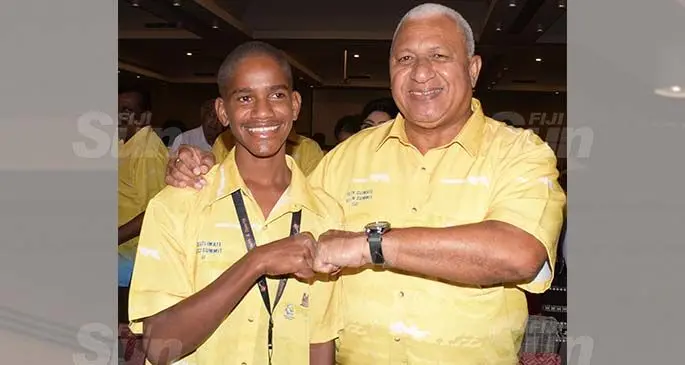 Fiji Youth Climate Change Ambassador Timoci Naulusala (left) with Prime Minister Voreqe Bainimarama during the opening of the National Youth Climate Action Summit at Grand Pacific Hotel on March 16, 2021. Photo: Ronald Kumar.