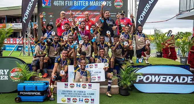 Dominion Brothers Under-21 players and officials receive their prize for winning the U21 category of the Fiji Bitter Marist 7s tournament at the ANZ Stadium, Suva, on March 26, 2022. Photo: Leon Lord 