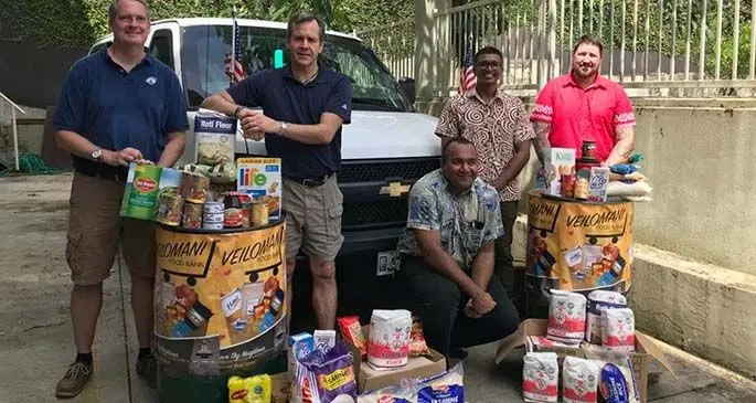 His Excellency Joseph Cella and the staff of the United States embassy alongside their generous donation towards the Veilomani Food Bank. Photo: US Embassy-Fiji