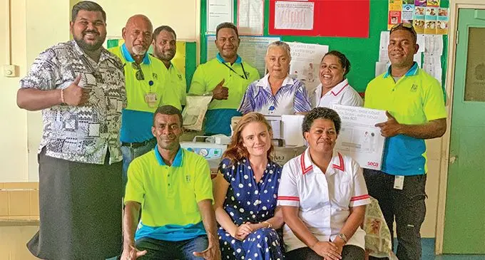 FIJI Water Foundation members, medical staff and Cure Kids executive Jen Miller (seated middle front) at the Tavua Hospital during the donation of the equipment. Photo: FIJI Water