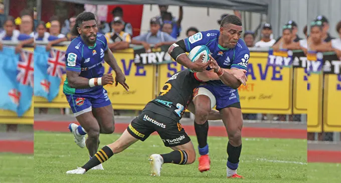 Swire Shipping Fijian Drua centre Apisalome Vota is tackled by Chiefs halfback and captain Brad Weber while Drua’s halfback Frank Lomani comes in for support on May 28, 2022. Vota scored two tries but they went down 35-24. Photo: Waisea Nasokia