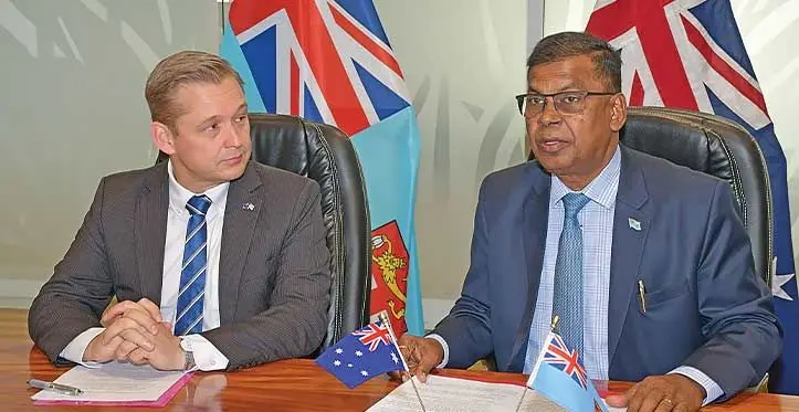 Australian High Commission in Fiji Chargé d’affaires Stuart Watts with Minister for Finance Biman Prasad.