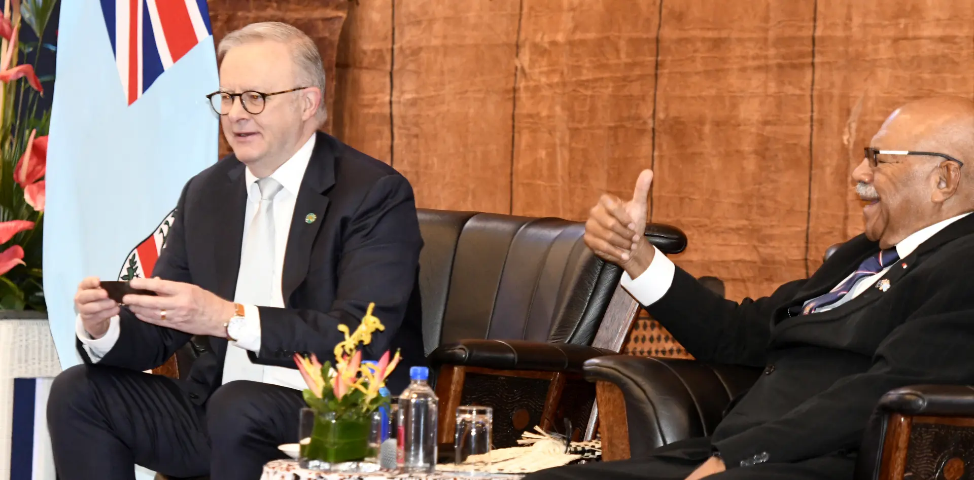 From left: Australian Prime Minister Anthony Albanese receives a kava bowl as Fiji Prime Minister Sitiveni Rabuka looks on during a traditional welcome ceremony in Suva on July 6, 2026.
