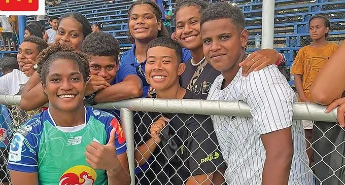 Rooster Chicken Fijian Drua women’s winger Adita Milinia Christine (left) with fans at Churchill Park, Lautoka on March 23, 2024. Photo: Fijian Drua Media