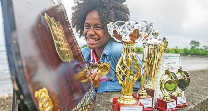 Ruth Seru with her awards.  Photo: Leon Lord