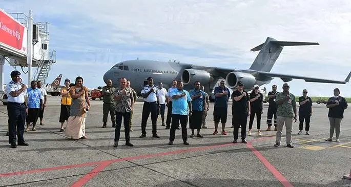 Standing front row from left: Australian High Commissioner, John Feakes, Minister for Rural and Maritime Development, Disaster Management, Defence, National Security and Policing, Inia Seruiratu, New Zealand High Commissioner, Jonathan Curr and Minister for Infrastructure, Meteorological Services, Lands and Mineral Resources Jone Usamate with others in front of the Royal Australian Air Force Boeing C-17A Globemaster III at the Nadi International Airport on April 18, 2020, welcoming relief supplies delivered by the Australian and New Zealand Defence Forces. Photo: Mereleki Nai
